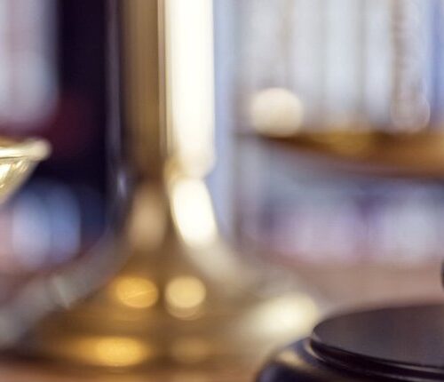 beachside legal judge gavel scales of justice and law books in court 1920x570 1