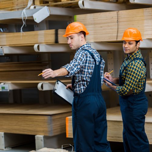 two multicultural workers in uniform standing near 2023 11 27 04 56 14 utc